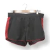 IMG_20251106_191803 Short deportivo negro con franjas rojas Reebok – Talla M