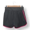 IMG_20251106_191950 Short deportivo negro con bordes fucsia Umbro – Talla S